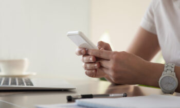 Businesswoman looking important contact on phone