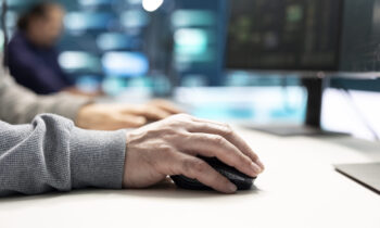 Cyber security experts in governmental hacking room working on securing networks